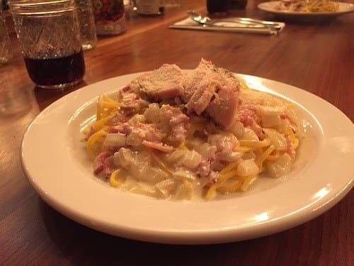 Spaghetti carbonara with smoked bacon, topped with grilled free range chicken - Nutrafarms