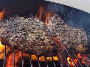 Classic-T-Bone-Steak-Dinner-Grilled-Asparagus-Creamy-Kale-Caesar-Salad-Nutrafarms-Grass-Fed-Steak-Image-1