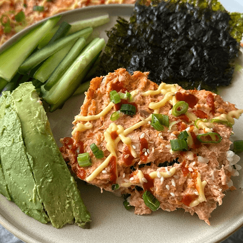 Nutrafarms wild-caught salmon sushi bake made with creamy rice nori, and sesame seeds Nutrafarms wild-caught salmon sushi bake made with creamy rice nori, and sesame seeds