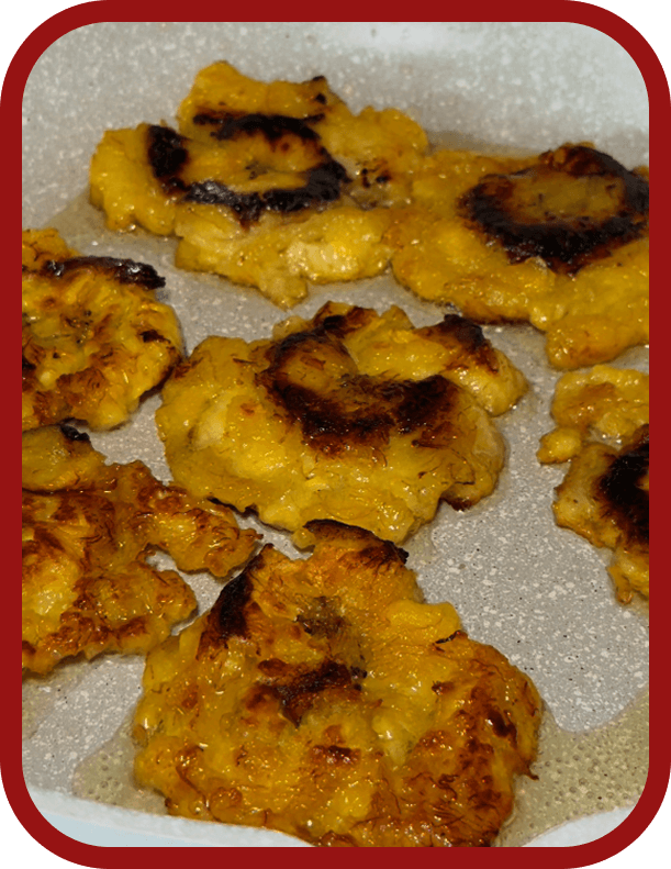 peeling-cutting-frying-and-flattening-plantains-to-make-tostones peeling-cutting-frying-and-flattening-plantains-to-make-tostones